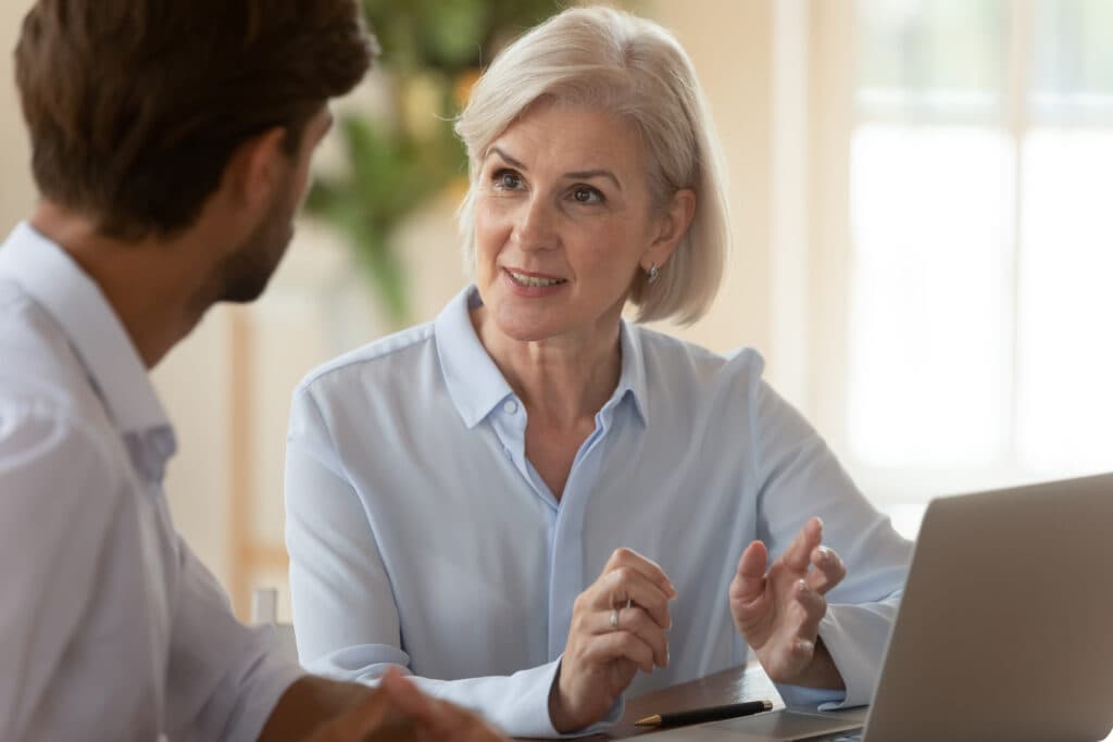 A woman discussing life coach advertising services