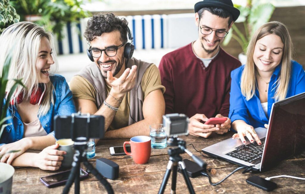A group of four individuals are creating content for a business blog.