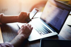 why you should build an email list | person on phone and computer