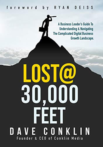 The cover of Dave Conklin’s book, featuring the silhouette of a mountain on top of which a man holding a briefcase and a spyglass stands